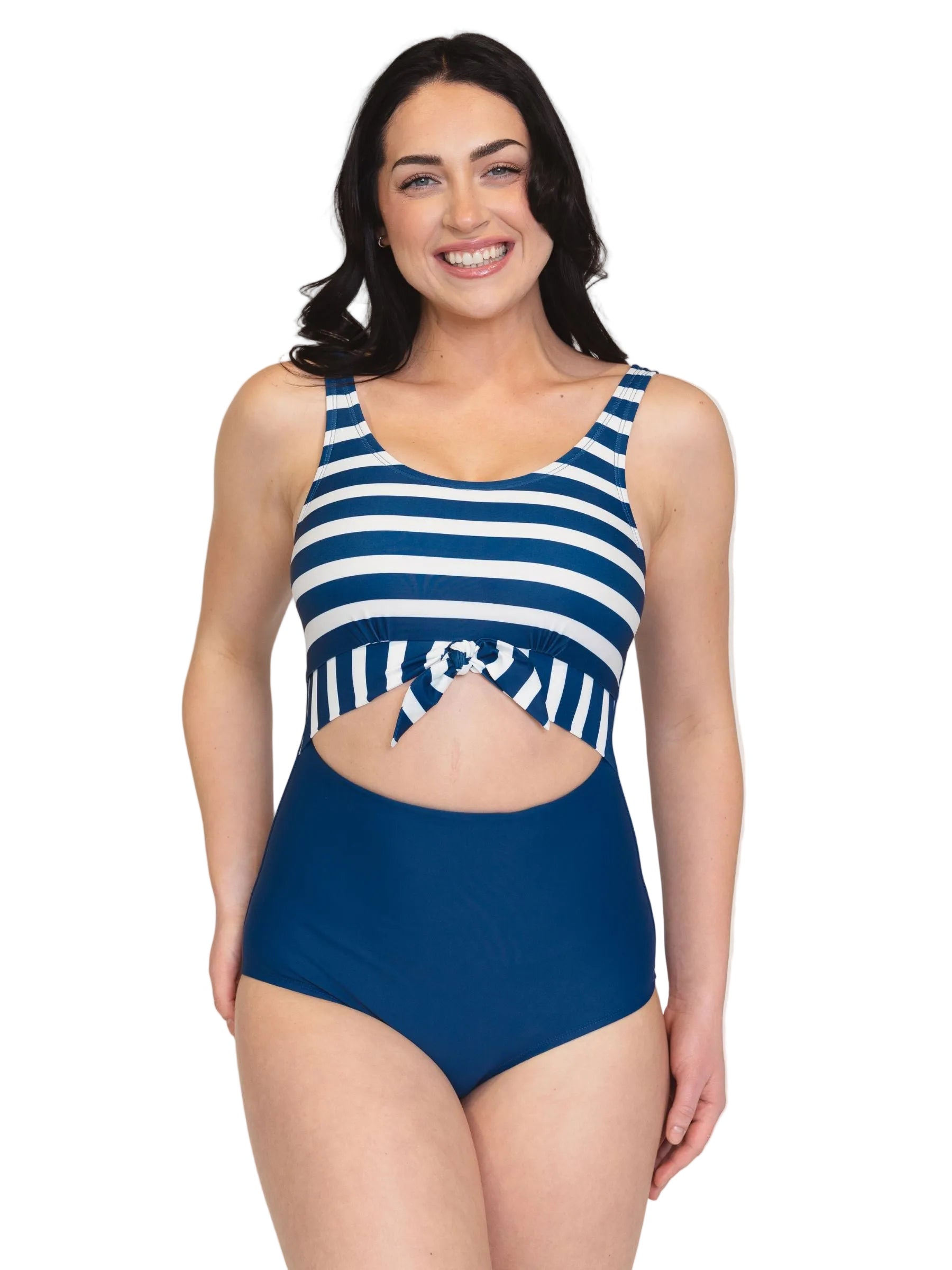 Woman wearing a blue and white striped swimsuit on a plain background