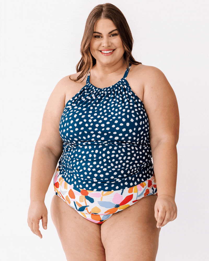 GIF of a woman wearing an Indigo dot double-cinch swim top and a multi color floral swim bottom