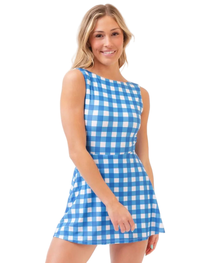 Woman wearing a blue and white checkered dress on a white background