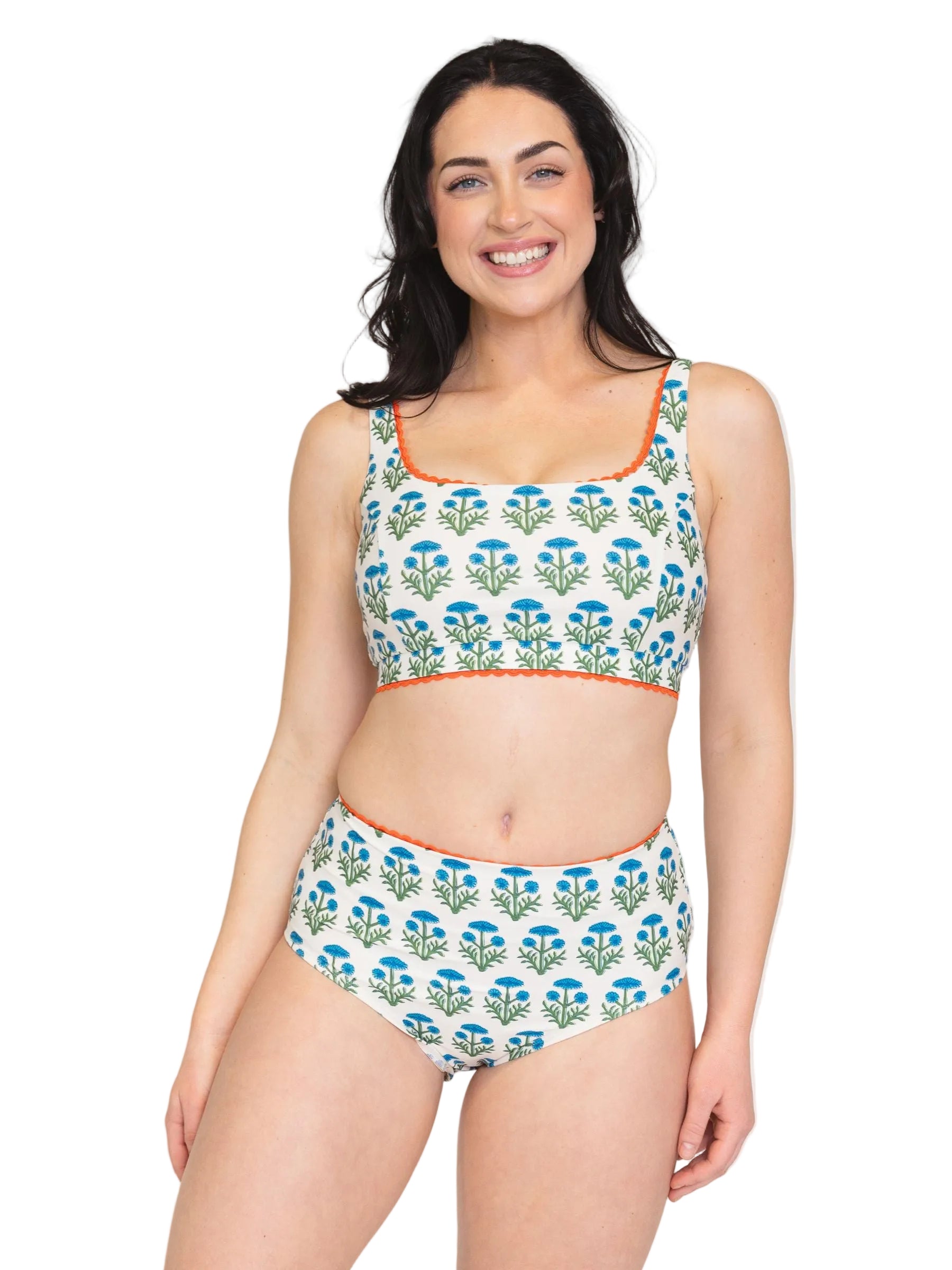 Woman wearing a floral bikini set on a white background