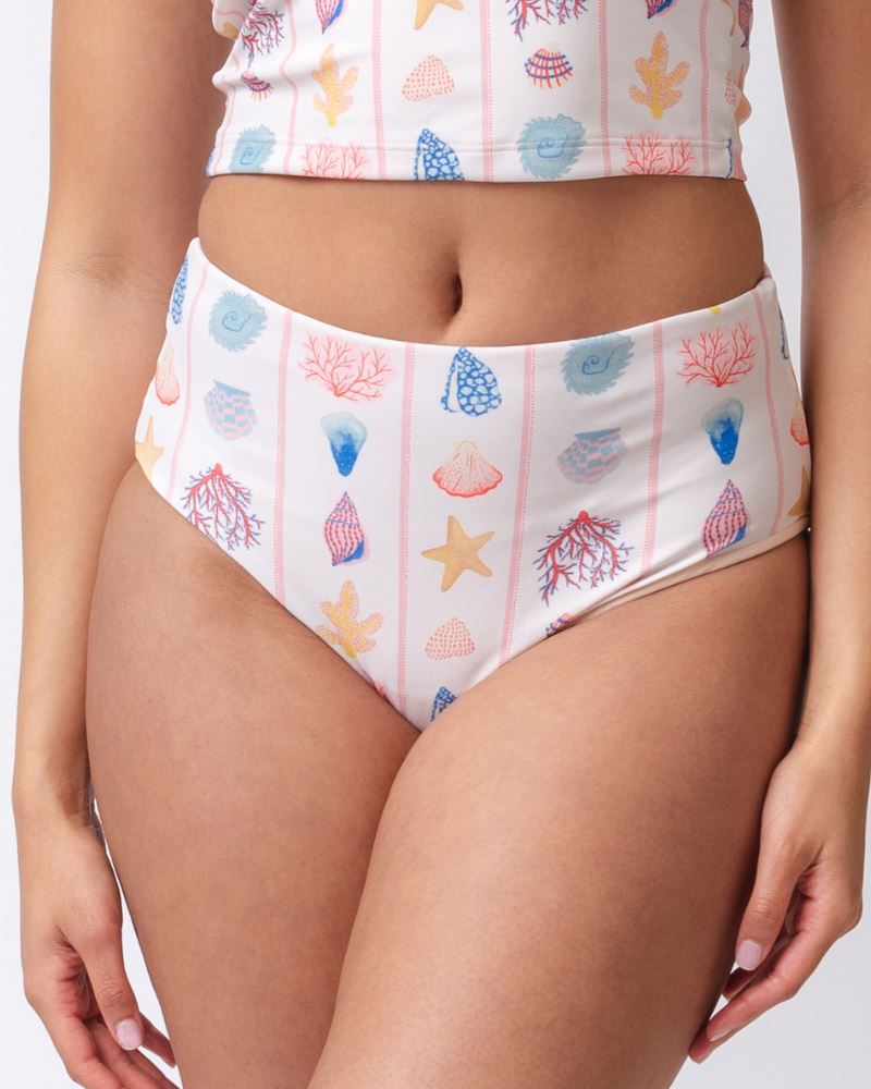 Close up photo of a woman wearing a seashell striped high waist swim bottom