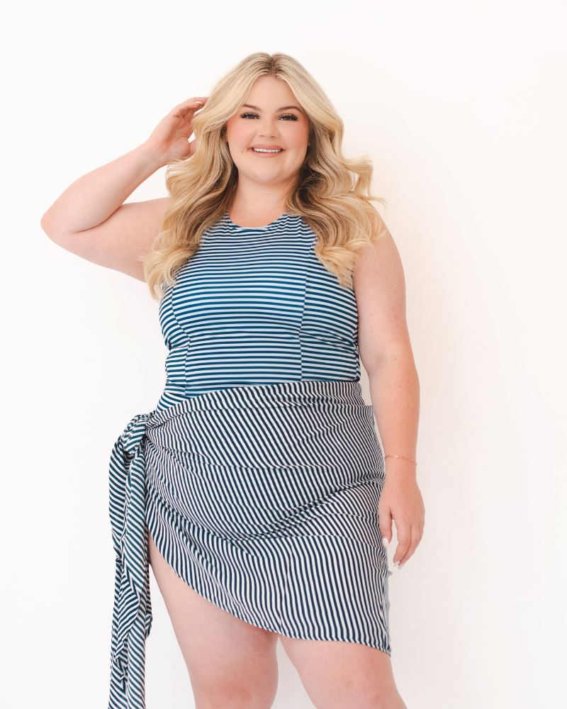 Photo of a woman wearing a blue and white stripe Sarong and a blue and white stripe swim top