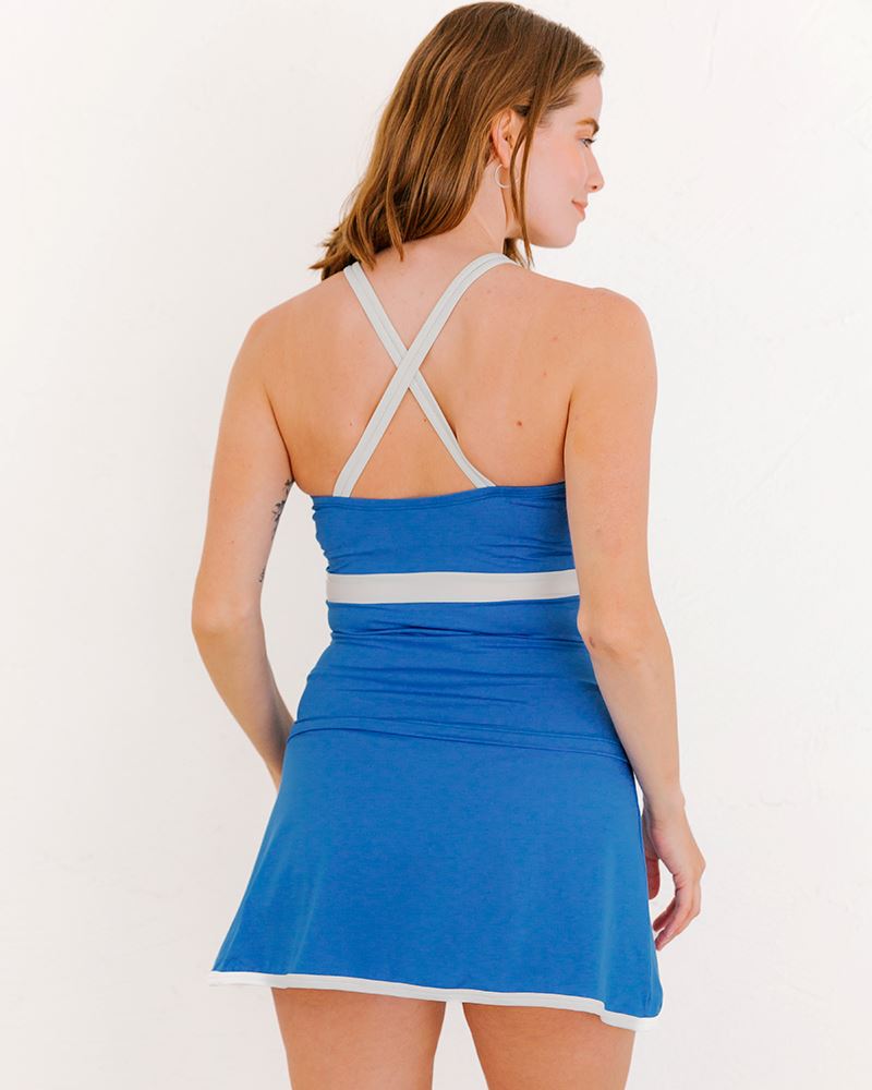 Photo of a woman wearing a Capri keyhole swim top and a capri swim skirt bottom back angle