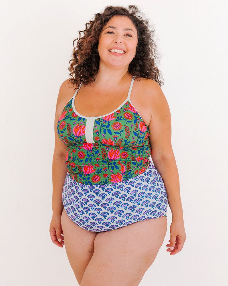 Photo of a woman wearing a Fresco Floral swim crop top and a Block floral swim bottom