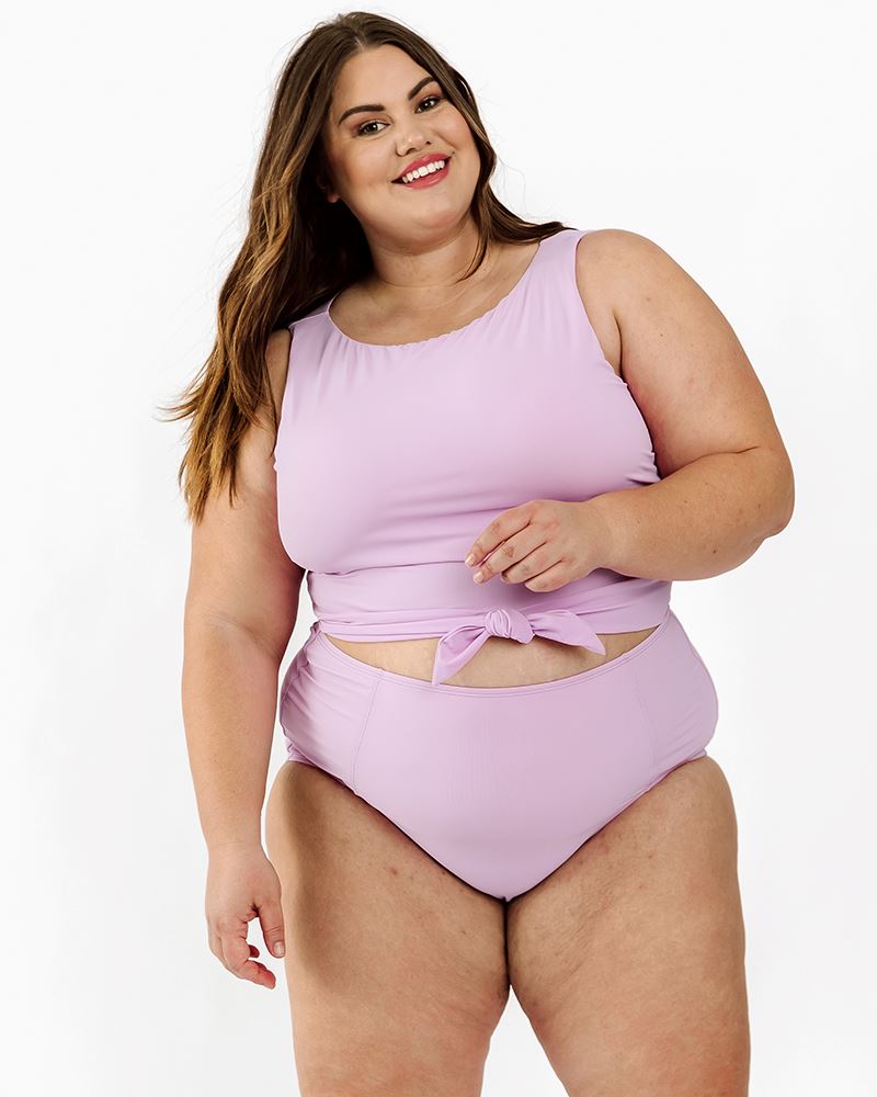 Photo of a woman wearing a Lilac swim bottom and a Lilac swim crop top