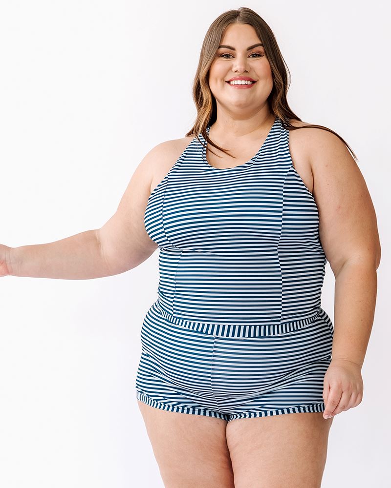 Photo of a woman wearing an Indigo stripe cross-back swim crop top and an Indigo stripe swim short bottom