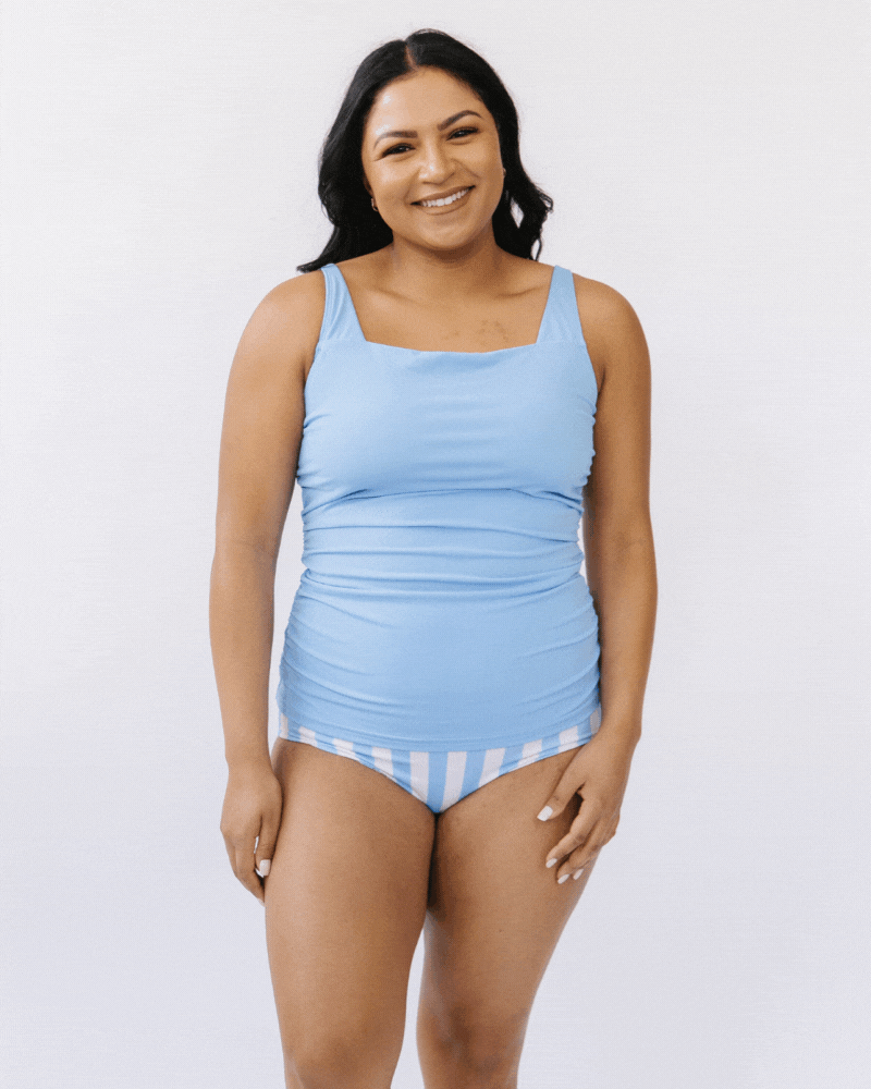 GIF of a woman wearing a peri square neck swim top and a peri stripe swim bottom