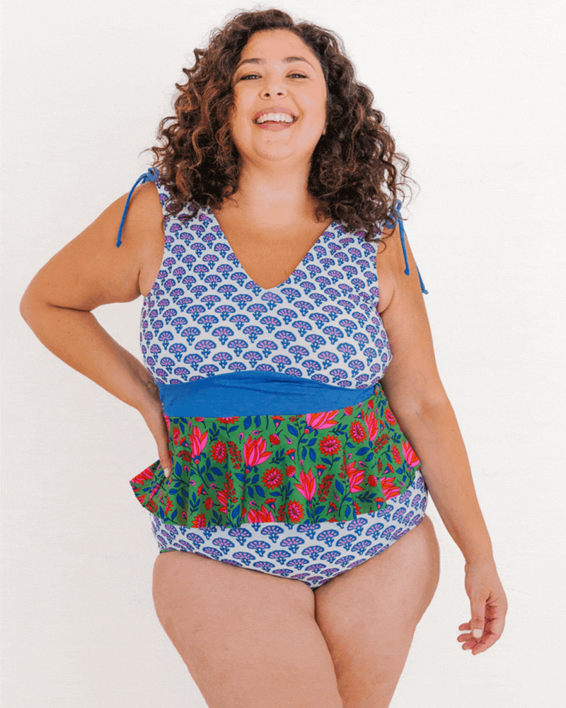 GIF of a woman wearing a Block floral peplum swim top and a Block floral swim bottom