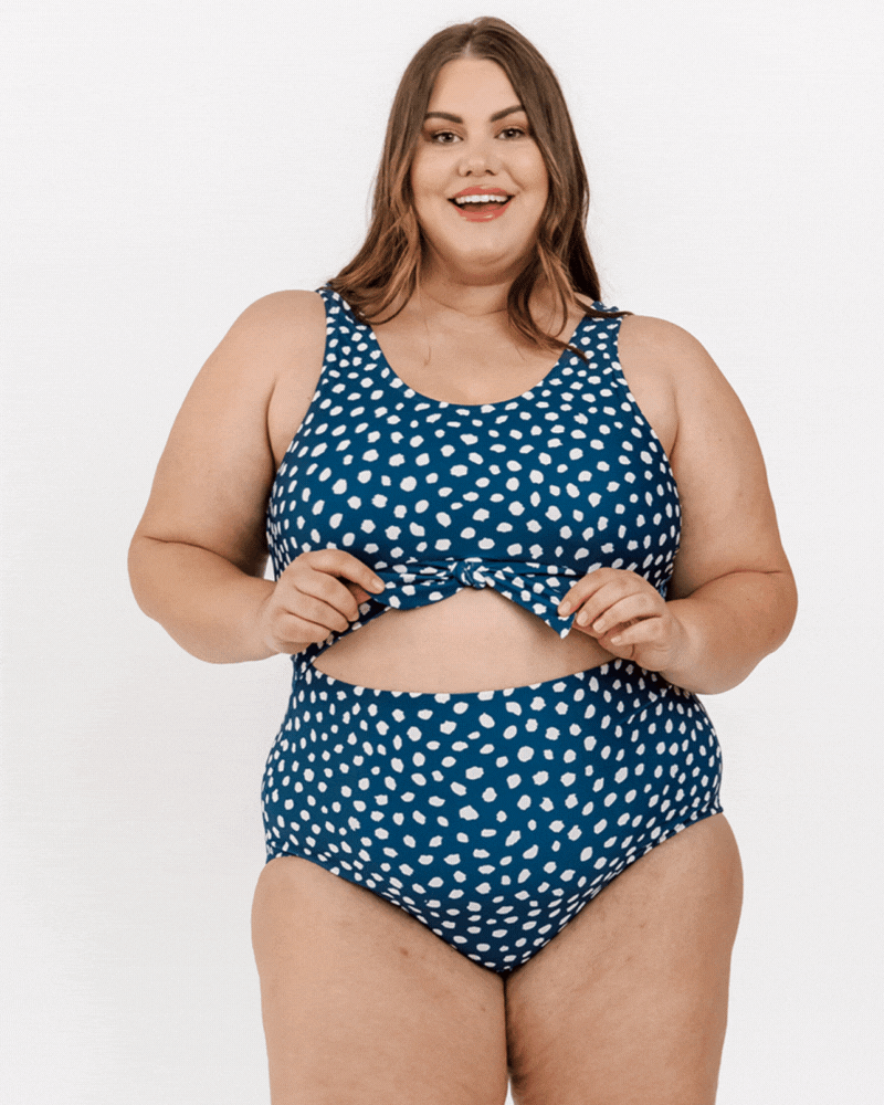 GIF of a woman wearing an Indigo dot knotted one-piece swim suit