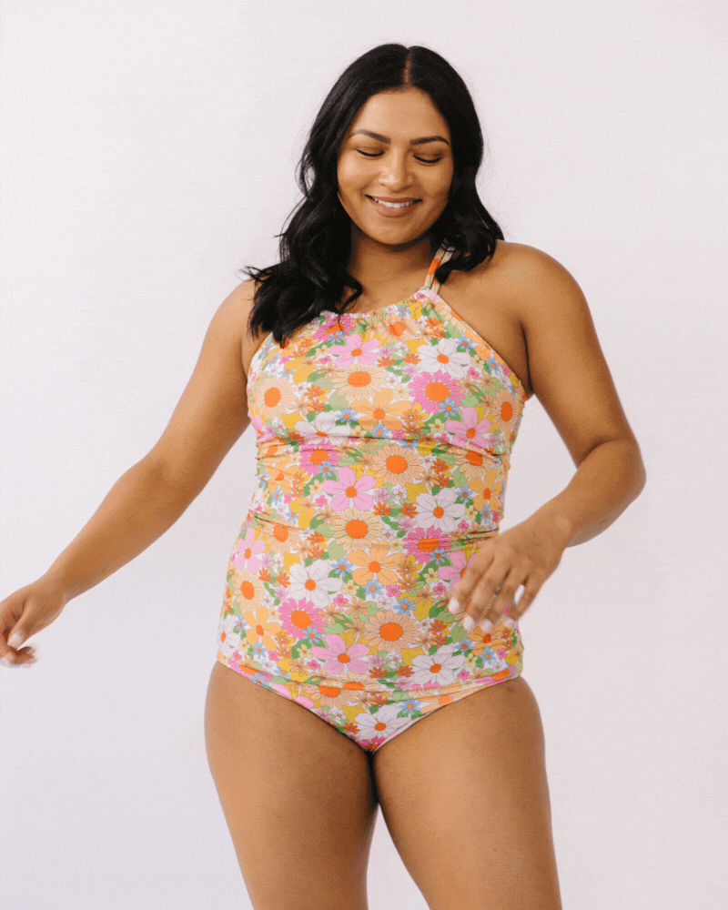 GIF of woman wearing a multi colored double strap swim tankini with multi colored swim bottoms
