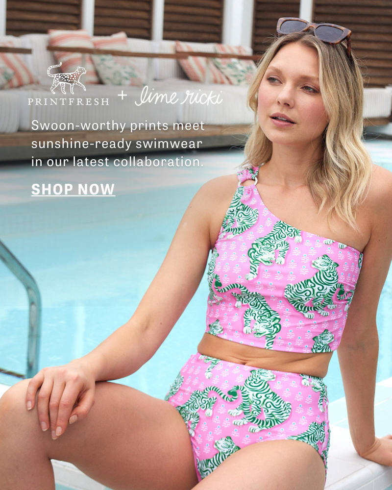 PrintFresh x Lime Ricki Swimwear is here! Swoon-worthy prints meet sunshine-ready swimwear in our latest collaboration. | Shop the Collection! | A woman lounges poolside in a pink one-shoulder swim crop adorned with green tigers and matching high-waist bottoms. | Modest Swimwear | Inclusive Swimwear | Tankini 