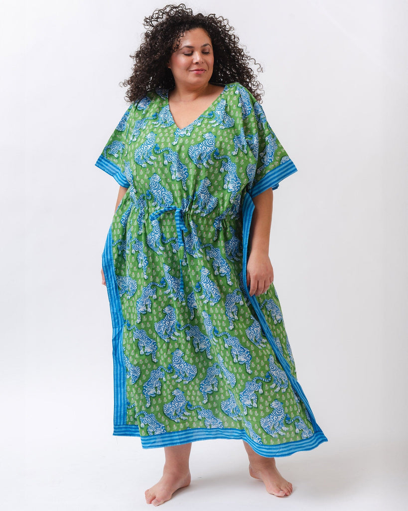 Photo of a woman wearing a bold green tiger print long cover up