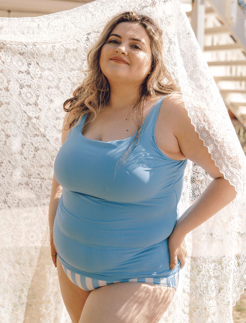 Photo of a woman wearing a peri square neck swim top and a peri stripe swim bottom