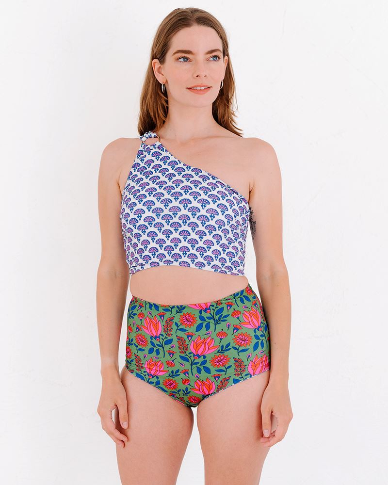 Photo of a woman wearing a Block Floral One-shoulder swim crop top and a multi color floral swim bottom