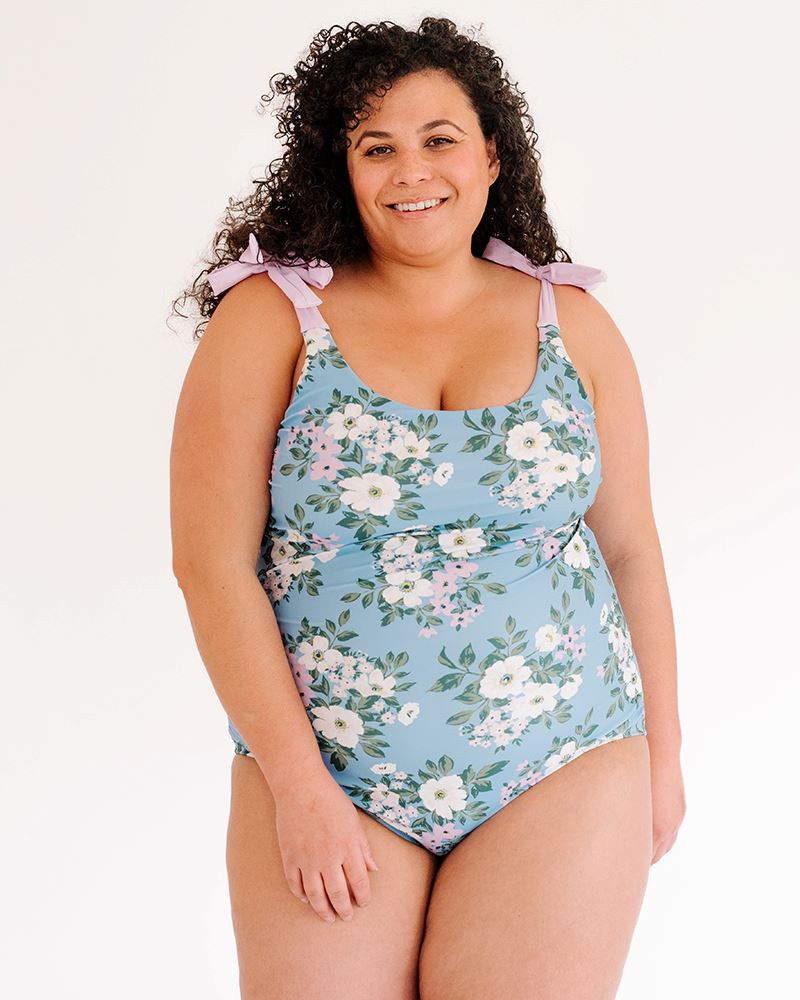 Photo of a woman wearing a Briar shoulder-tie one-piece swimsuit