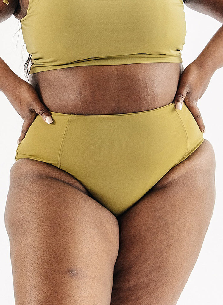 Photo of woman wearing green swim bottoms