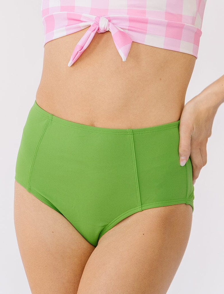 Photo of woman wearing green high waist swim bottoms