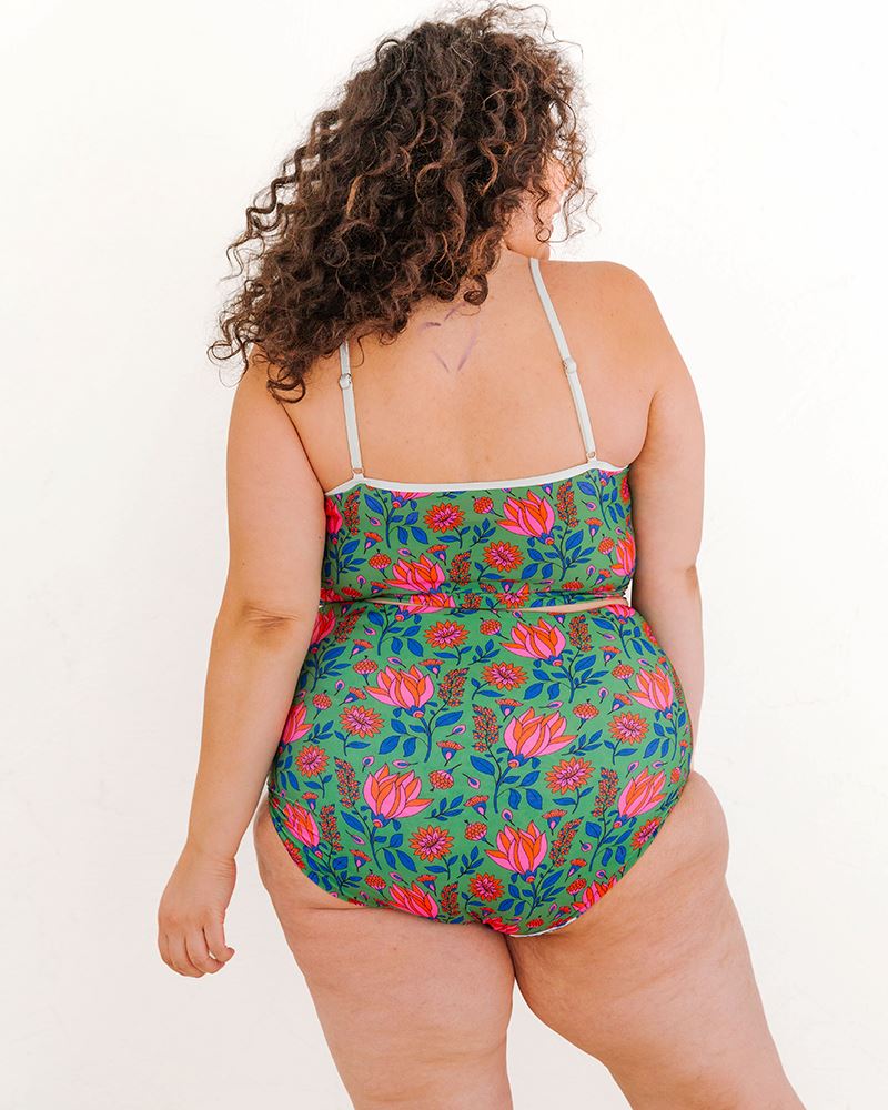 Photo of a woman wearing a Fresco Floral swim crop top and a Fresco floral swim bottom back angle