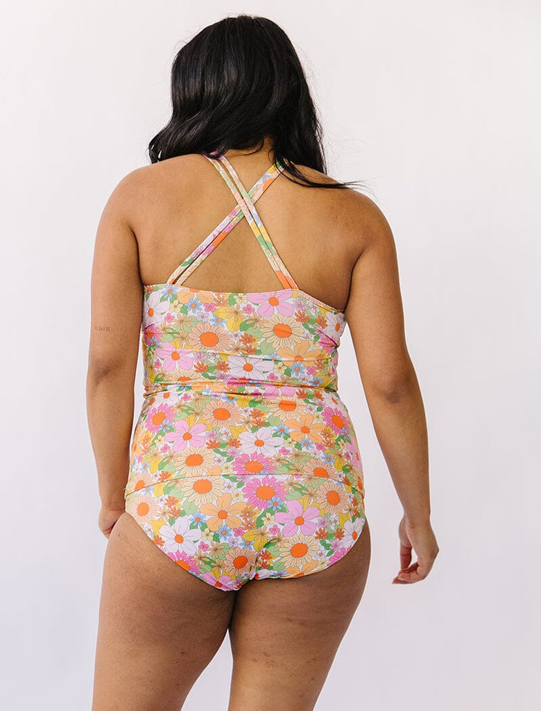 Photo of woman wearing multi colored double strap swim tankini with multi colored floral bottoms back angle
