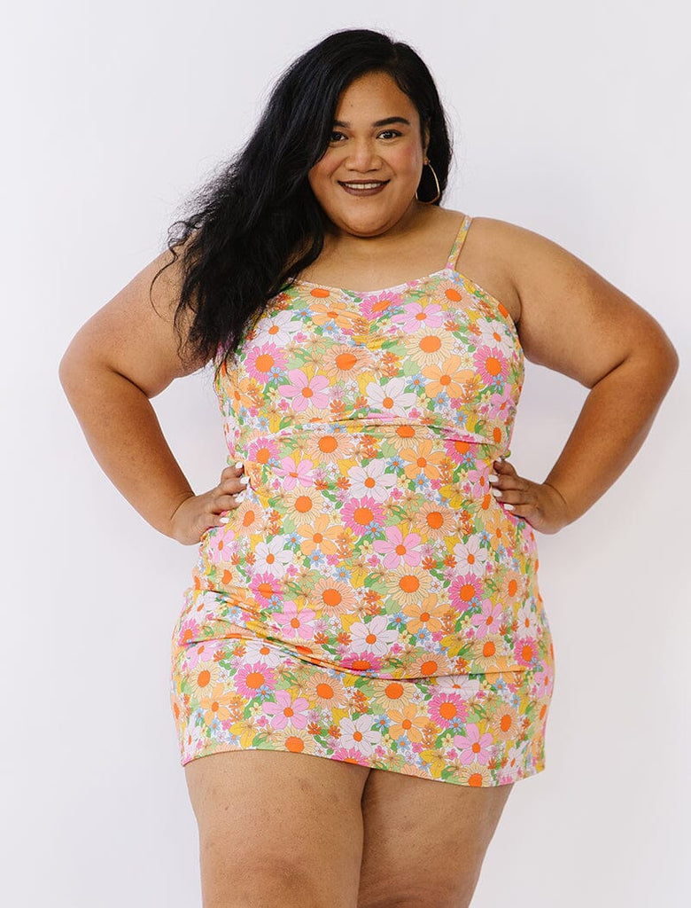 Photo of woman wearing multi colored floral swim dress