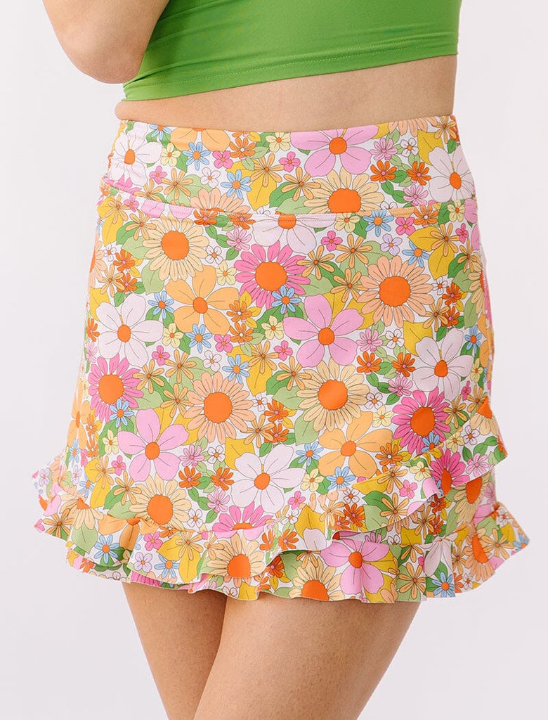 Photo of woman wearing multi colored floral swim skirt