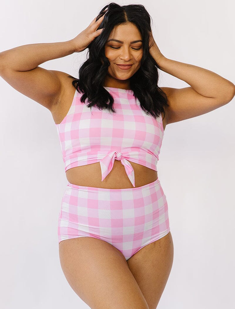 Photo of woman wearing pink gingham cropped swim top with pink gingham swim bottoms