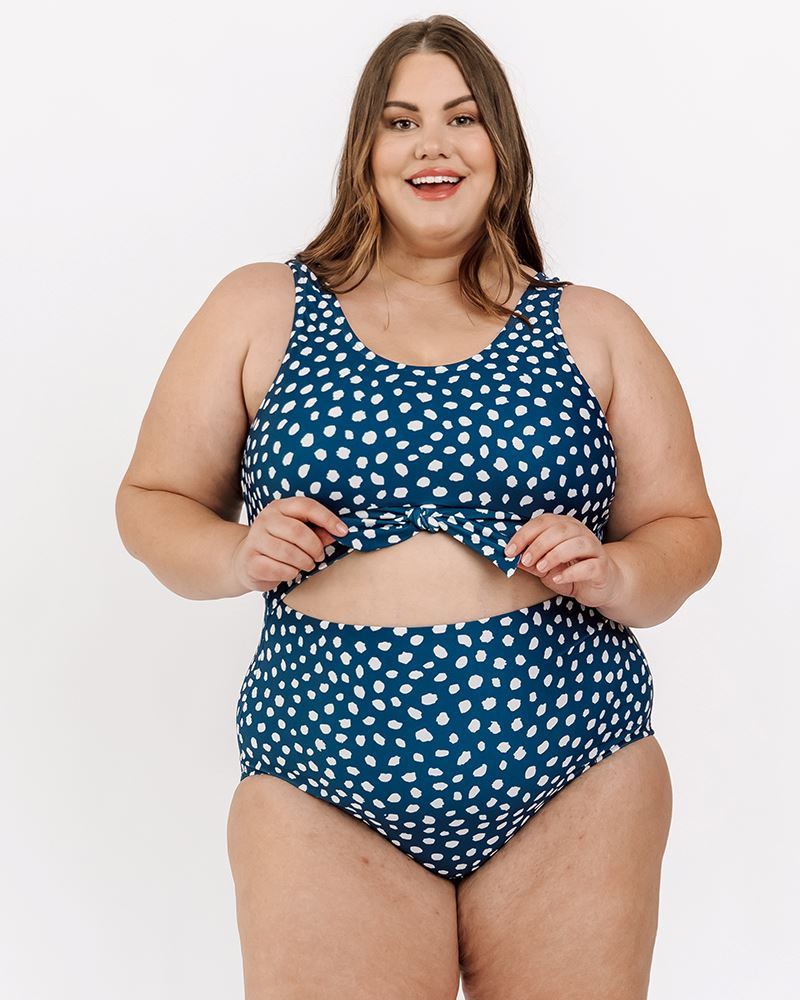 Photo of a woman wearing an Indigo dot knotted one-piece swim suit
