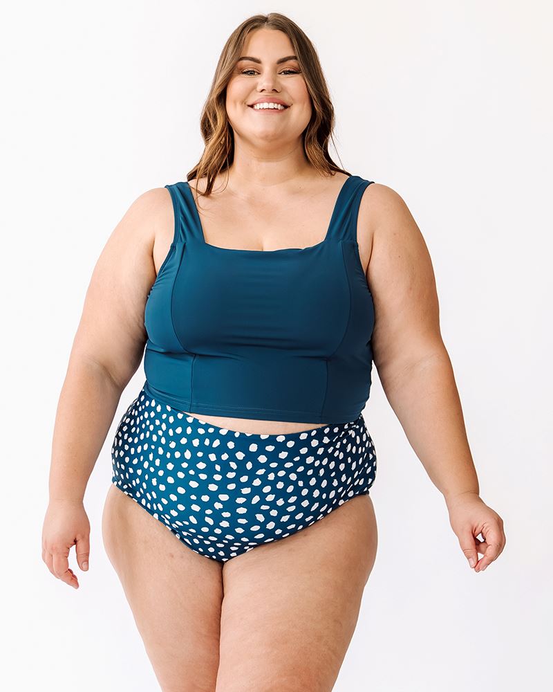 Photo of a woman wearing Indigo dot reversible high-waist bottoms and Indigo square neck cropped