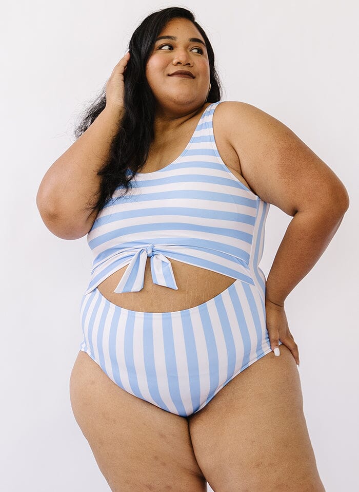 Photo of a woman wearing a peri stripe knotted one-piece swim suit