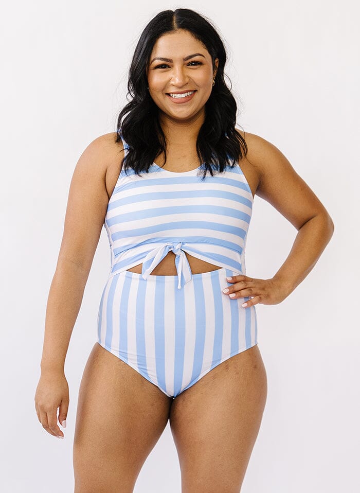 Photo of a woman wearing a peri stripe knotted one-piece swim suit