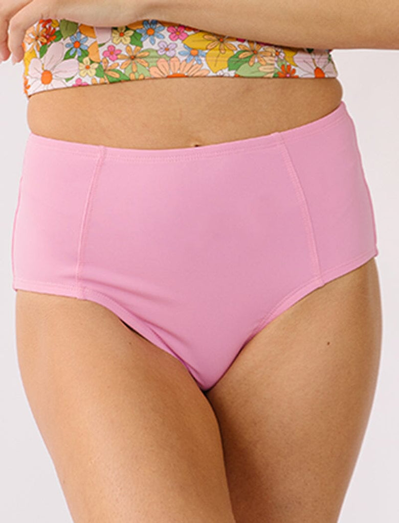 Photo of woman wearing pink high waist swim bottoms