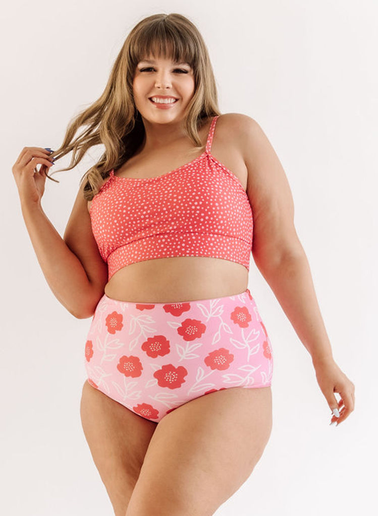 Photo of woman wearing pink dot bralette swim top with pink floral swim bottoms