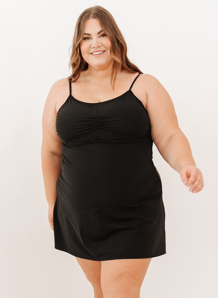 Photo of a woman wearing a black swim dress