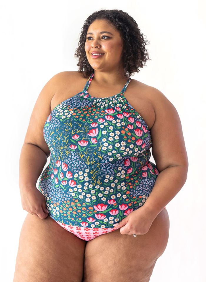 Photo of a woman wearing a Blixen double-cinch swim top and a pink floral swim bottom