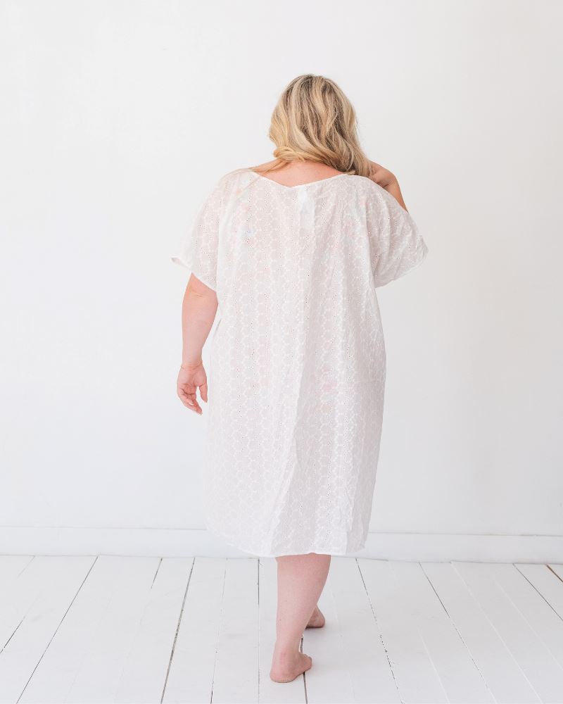 Photo of a woman wearing a white kaftan Cover-up back angle