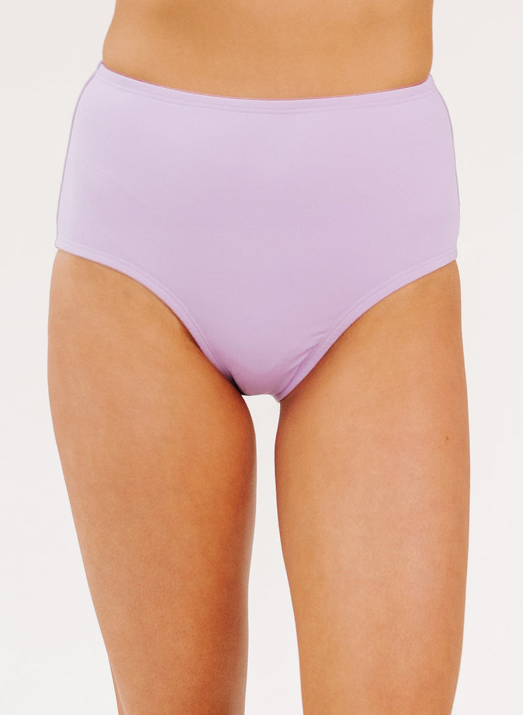 Up close photo of woman wearing lavender high waist swim bottoms